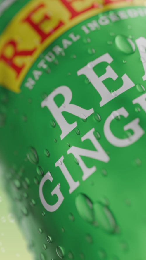 A video of Reed's Real Ginger Ale with pieces of ginger on a green background.